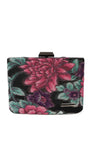Front view of Regina floral clutch with Luna logo plate and bold pink floral motif on a black base.