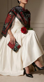 Regina floral clutch held with an ivory dress and black floral scarf for polished formal styling.