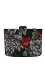 Regina floral clutch shown from the back with grey, red, and green floral fabric on a black base.