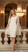 Rebeka ivory dress styled on black satin with white heels, silver jewelry, handbag and white rose