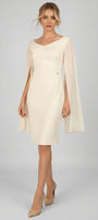 Rebeka ivory short dress with V neckline and sheer cape sleeves in an elegant chandelier setting