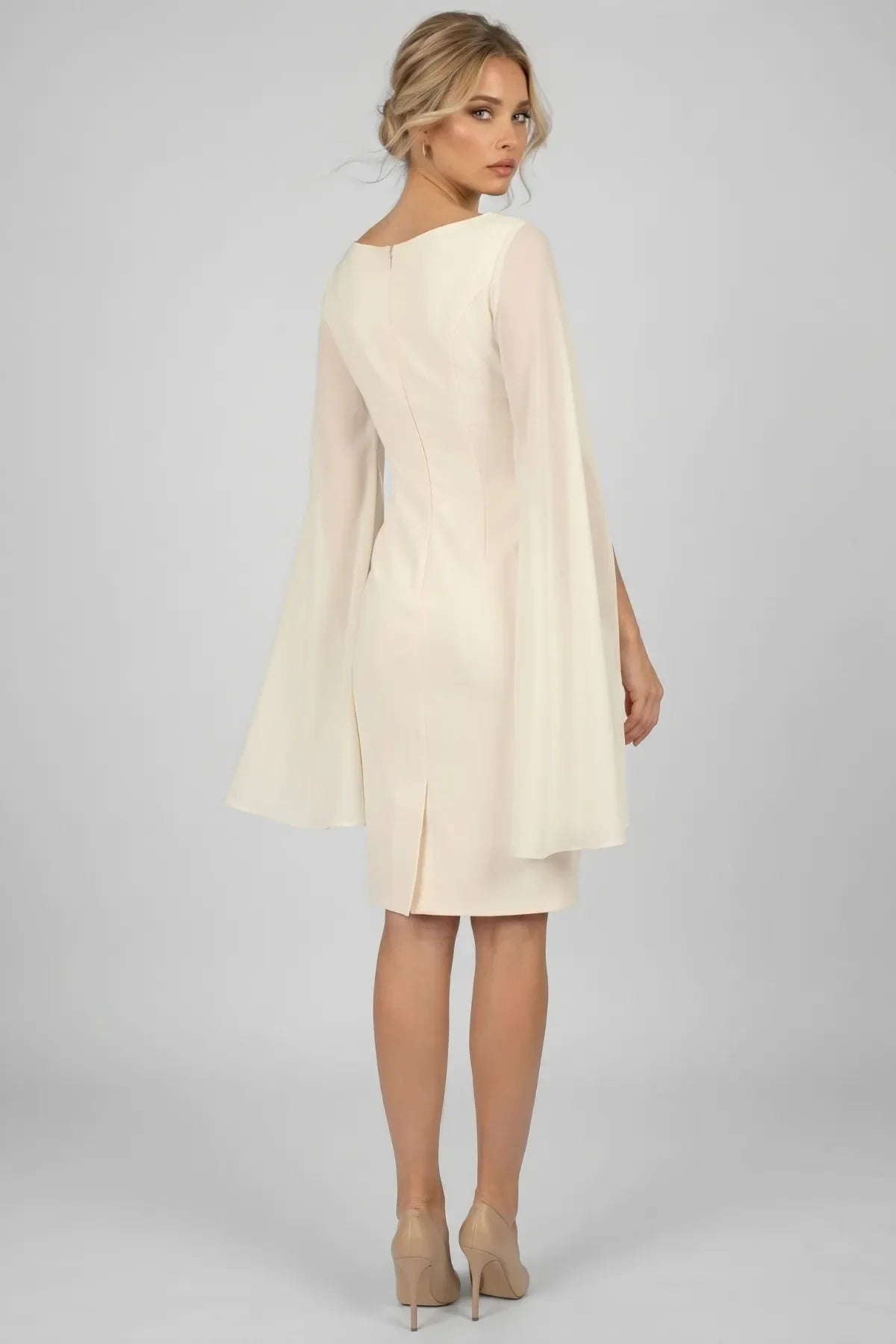 Front view of Rebeka ivory fitted short dress with V neckline and flowing sheer cape sleeves