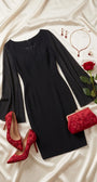 Rebeka black short dress shown alone with a V neckline, fitted sheath line and sheer cape sleeves