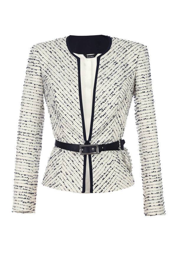 Flat lay of white tweed blazer showing contrast trim and waist belt