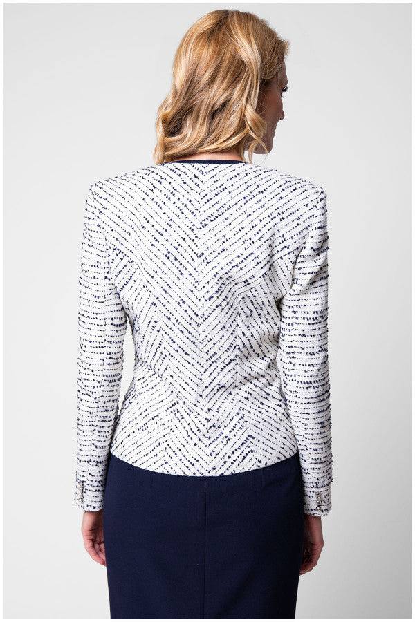 Back view of white tweed blazer highlighting tailored seams