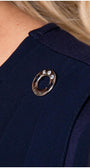 Close up of crystal cuff button on navy viscose blouse