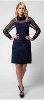 Model front view in navy floral jacquard dress with sheer long sleeves