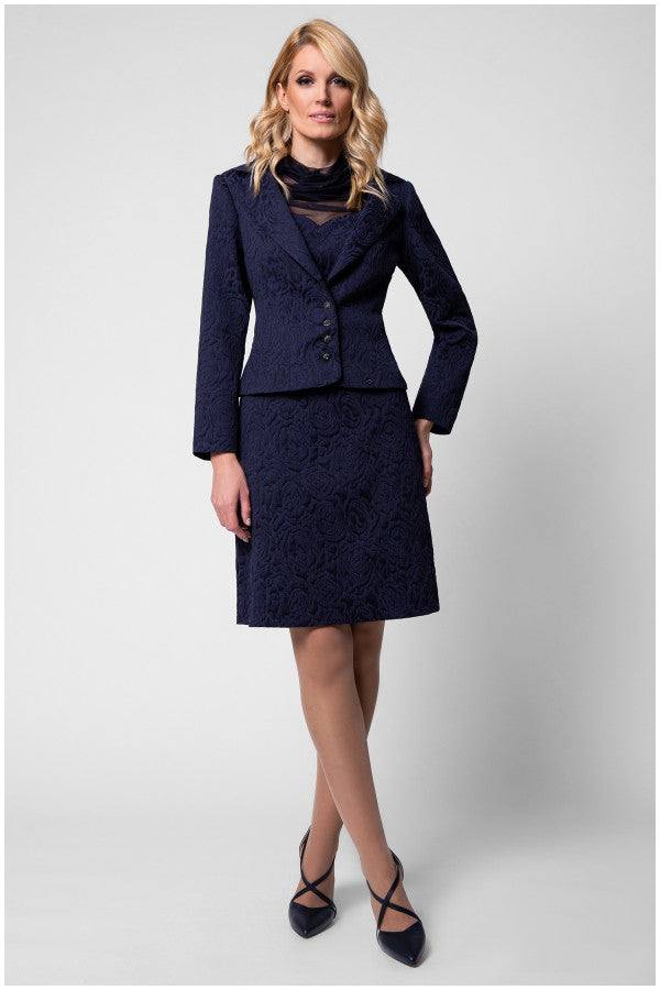Full length model in navy floral jacquard dress styled for office to evening