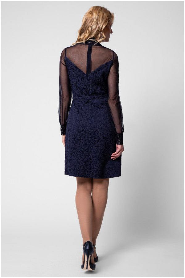 Back view of navy floral jacquard dress with illusion yoke and V detail