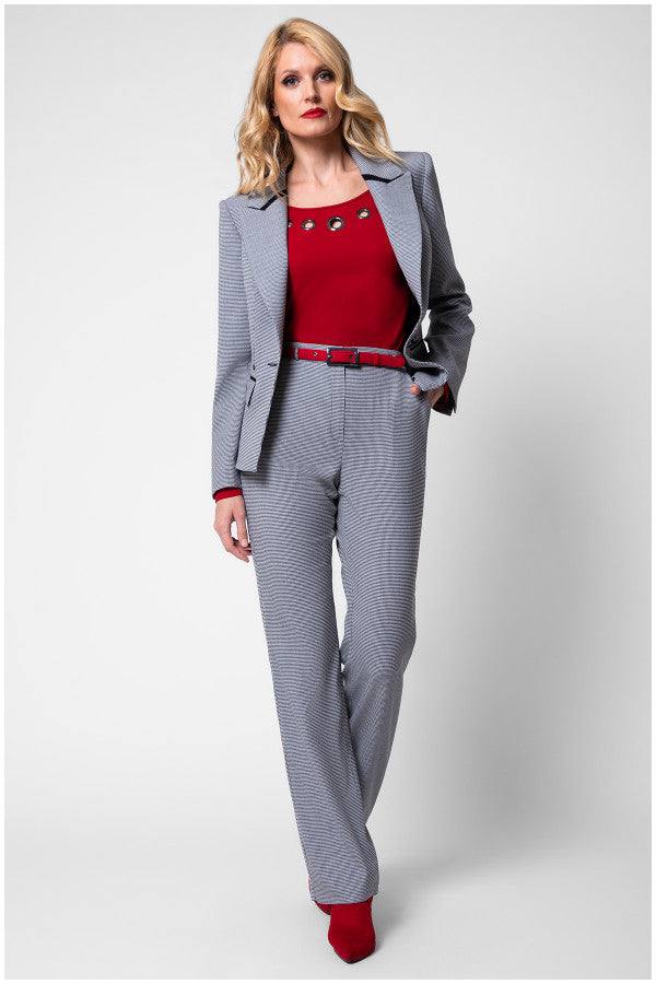 Woman wearing tailored Elena blazer with houndstooth pattern and matching Luna trousers in a professional look