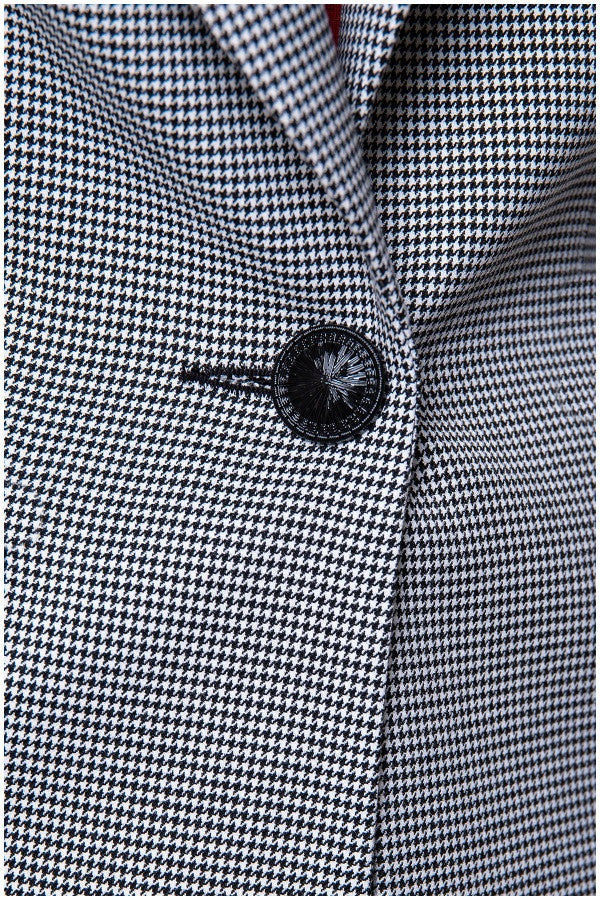 Close-up of tailored BLAZER ELENA houndstooth pattern with single black button and tailored viscose blend fabric detail