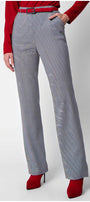 Elena Houndstooth Tailored Trousers styled with red belt and boots, showcasing elegance and modern design by Luna Fashion House