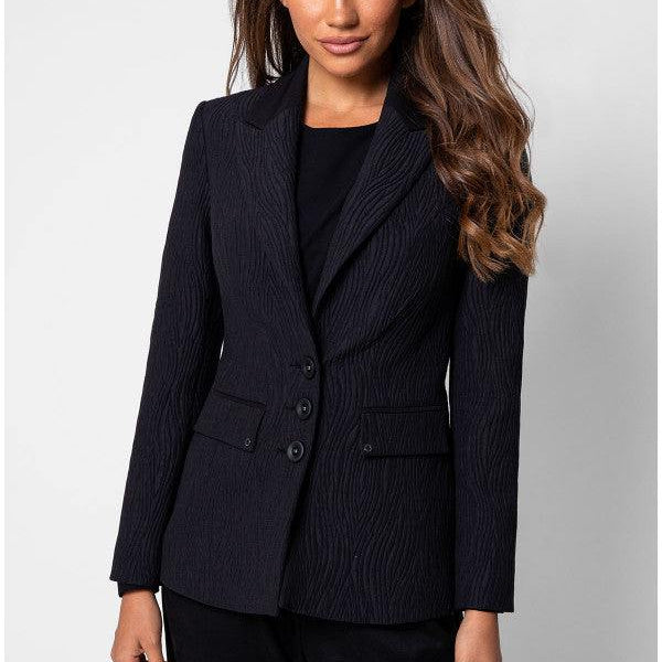 Model in black textured blazer and black trousers front view
