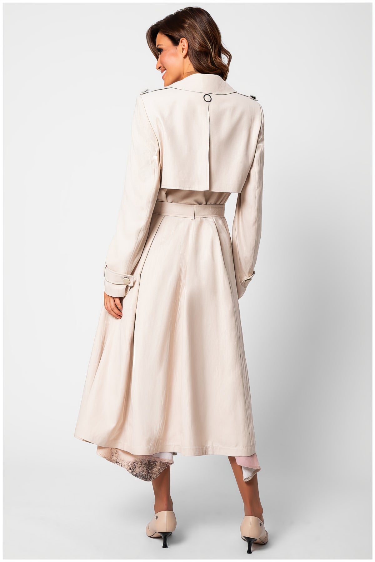 Woman wearing Kim Classic Long Coat in Beige with belted waist and subtle sheen, shown from back on white background