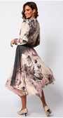 Woman twirling in Iris A-line Midi Dress in Blush Floral with soft floral patterns and flowing natural viscose fabric