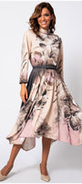Woman wearing Iris A-line Midi Dress in Blush Floral with soft floral patterns and flowing skirt posing gracefully