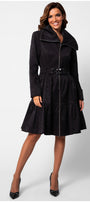 Woman wearing Iris Short Tailored Coat in Deep Black with flared skirt and belted waist against white background