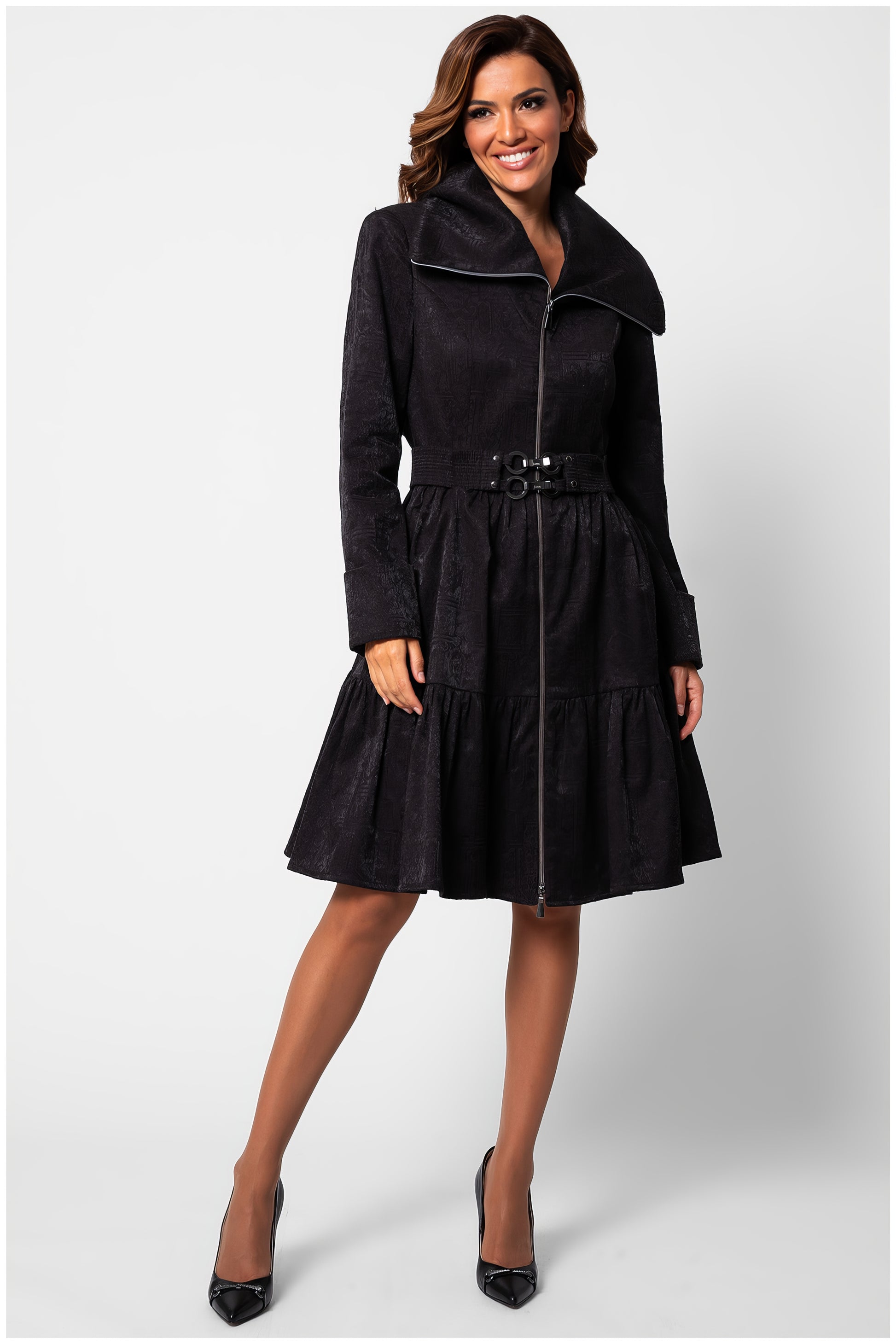 Woman wearing Iris Short Tailored Coat in Deep Black with flared skirt and belted waist against white background
