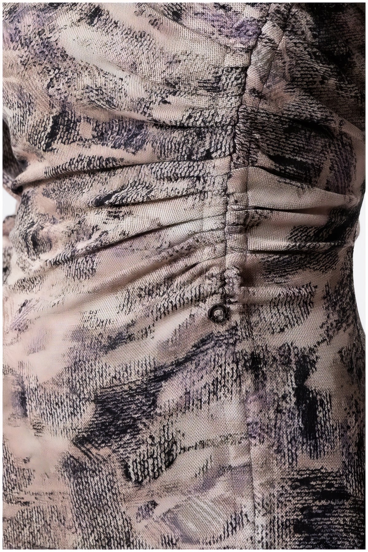 Close-up detail of textured fabric and stitching on the Mila Draped Midi Dress in Abstract Taupe showing delicate ruching design