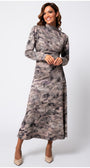 Woman wearing the Mila Draped Midi Dress in Abstract Taupe with long sleeves and a high neckline, smiling confidently.