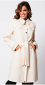 Woman wearing Rea Jacquard Trench Coat in Beige with textured fabric and belted waist posing against white background