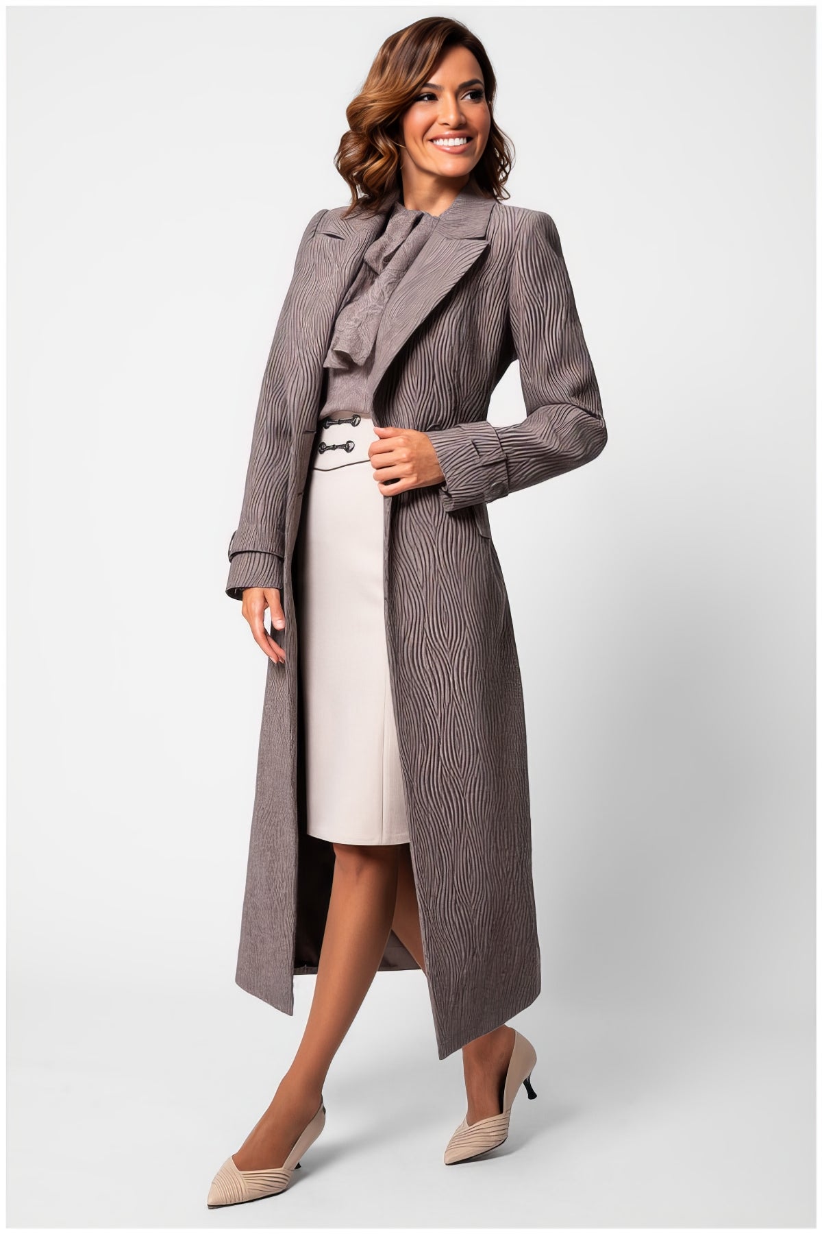 Woman wearing Isidora Long Textured Coat in Mocha with tailored fit and wave-like texture standing confidently