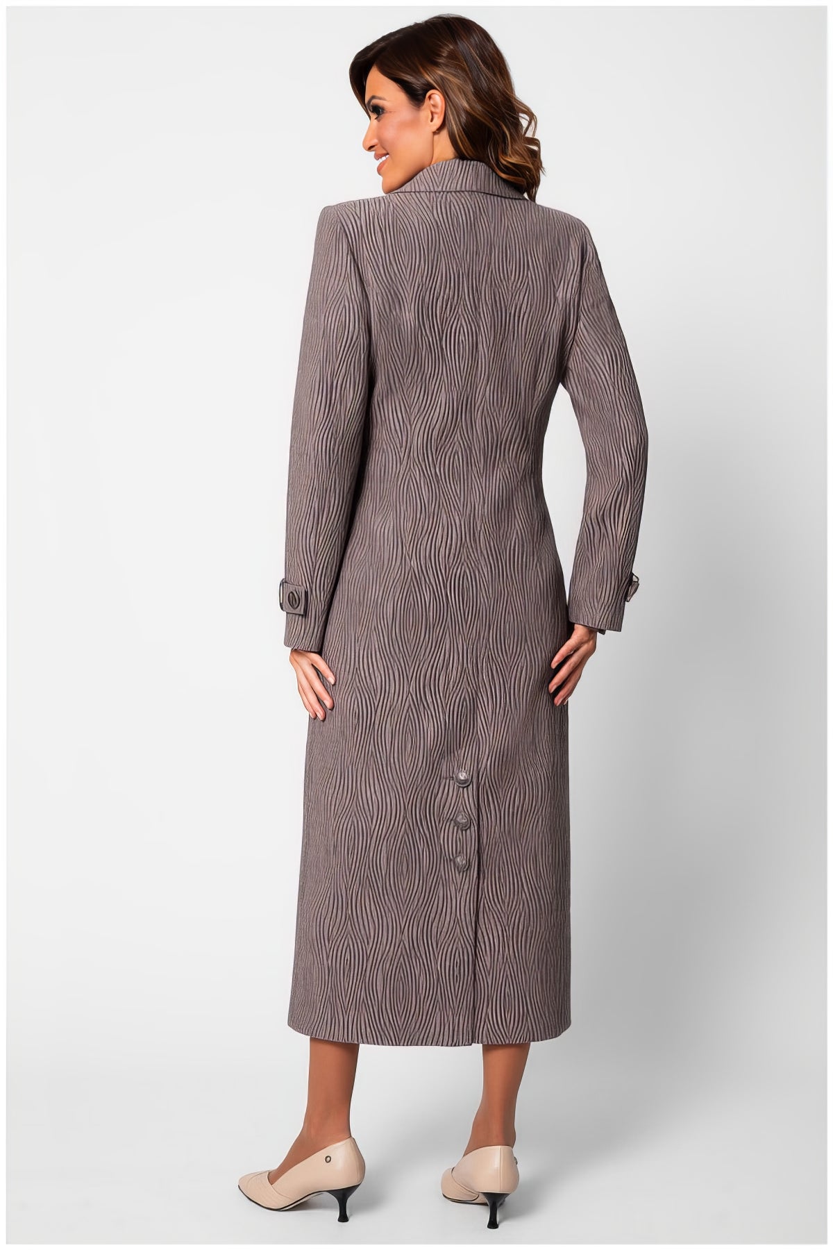 Back view of a woman wearing the Isidora Long Textured Coat in Mocha with wave-like texture and tailored fit