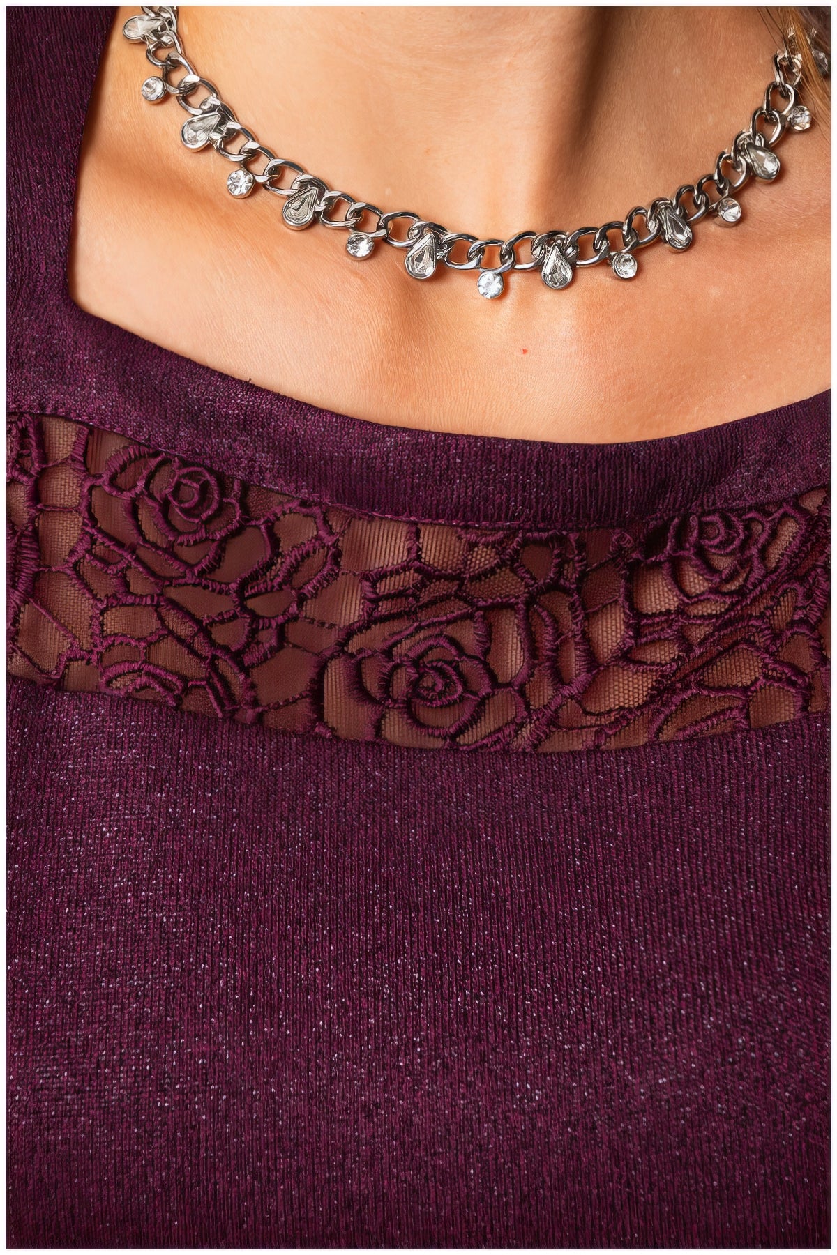 Close-up of lace neckline detail on the Jody Lace A-Line Dress in Bordeaux with subtle metallic fibers visible