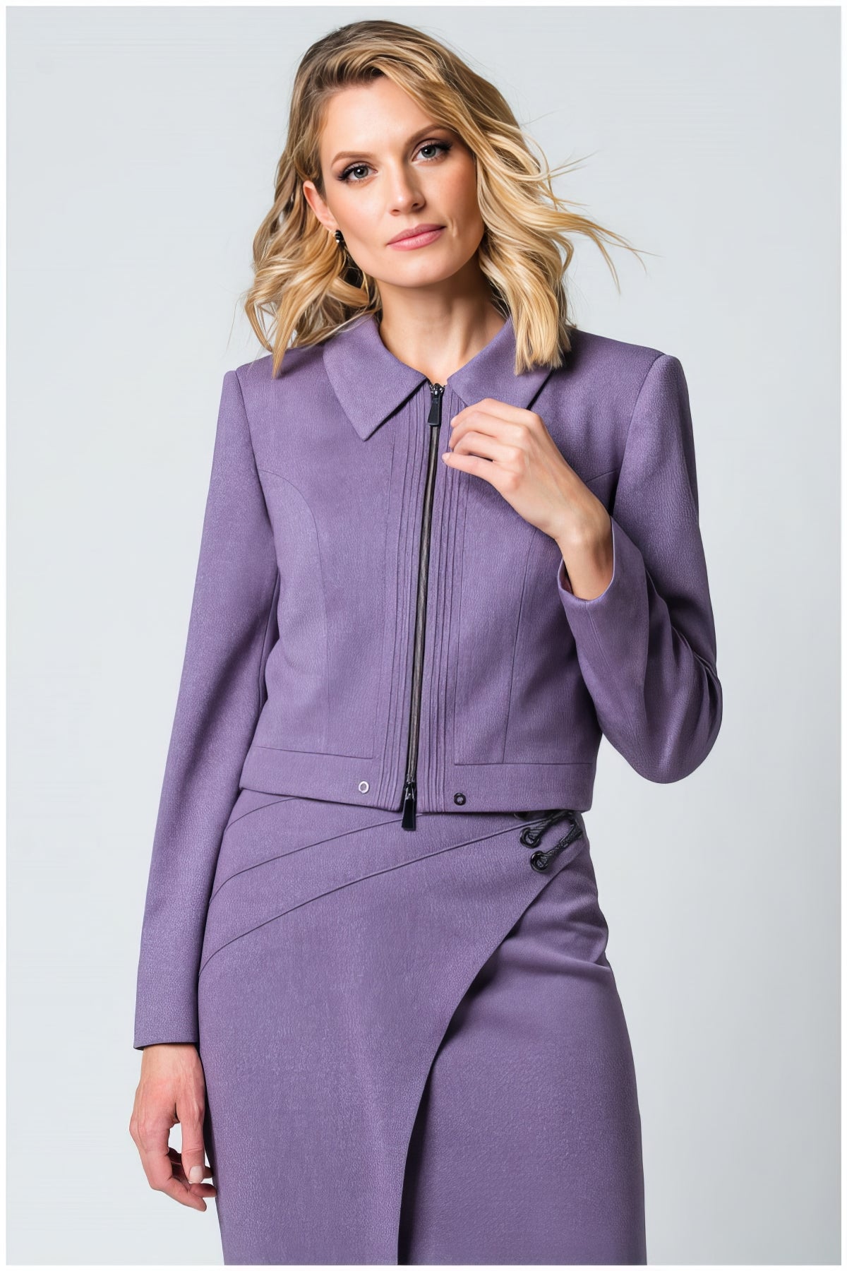 Woman wearing a tailored Neda Cropped Zip Blazer in Lilac with a hip-length silhouette and zip closure