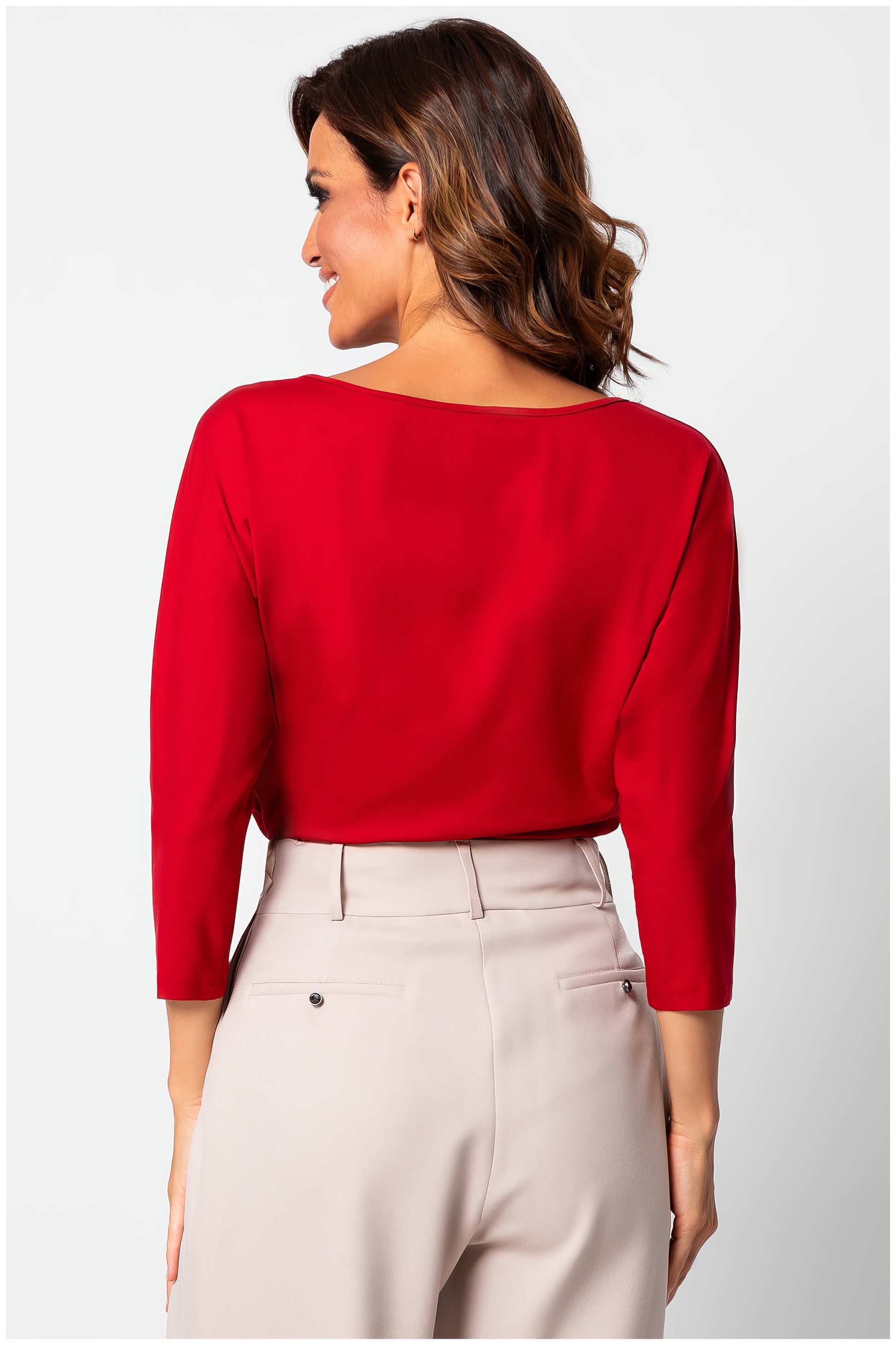 Woman wearing Eva Classic Top in Scarlet Red with three-quarter sleeves shown from back posing against white background