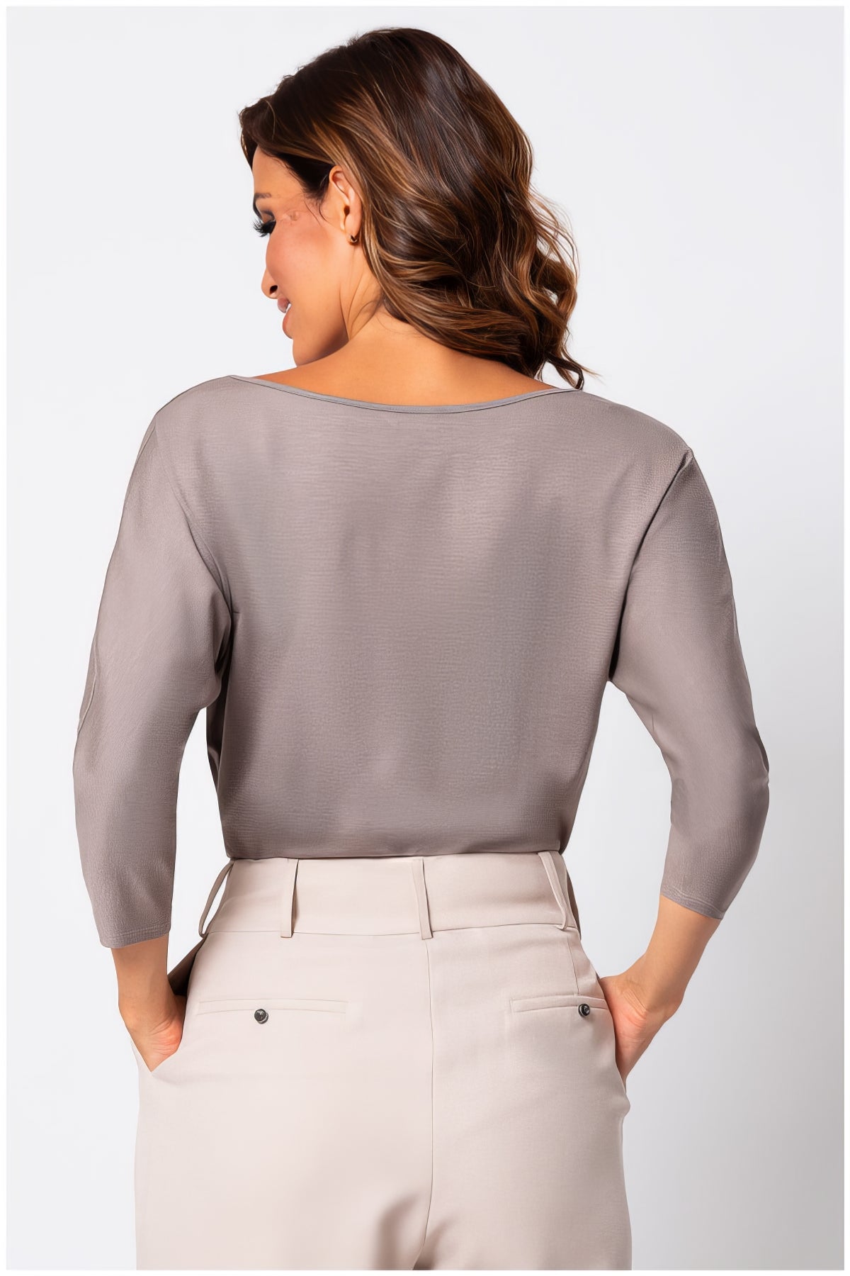 Woman wearing Eva Classic Top in Taupe Grey with soft viscose fabric and subtle stretch, viewed from the back.