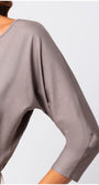 Close-up of soft fabric and relaxed sleeve detail on Eva Classic Top in Taupe Grey showcasing elegant drape and smooth texture