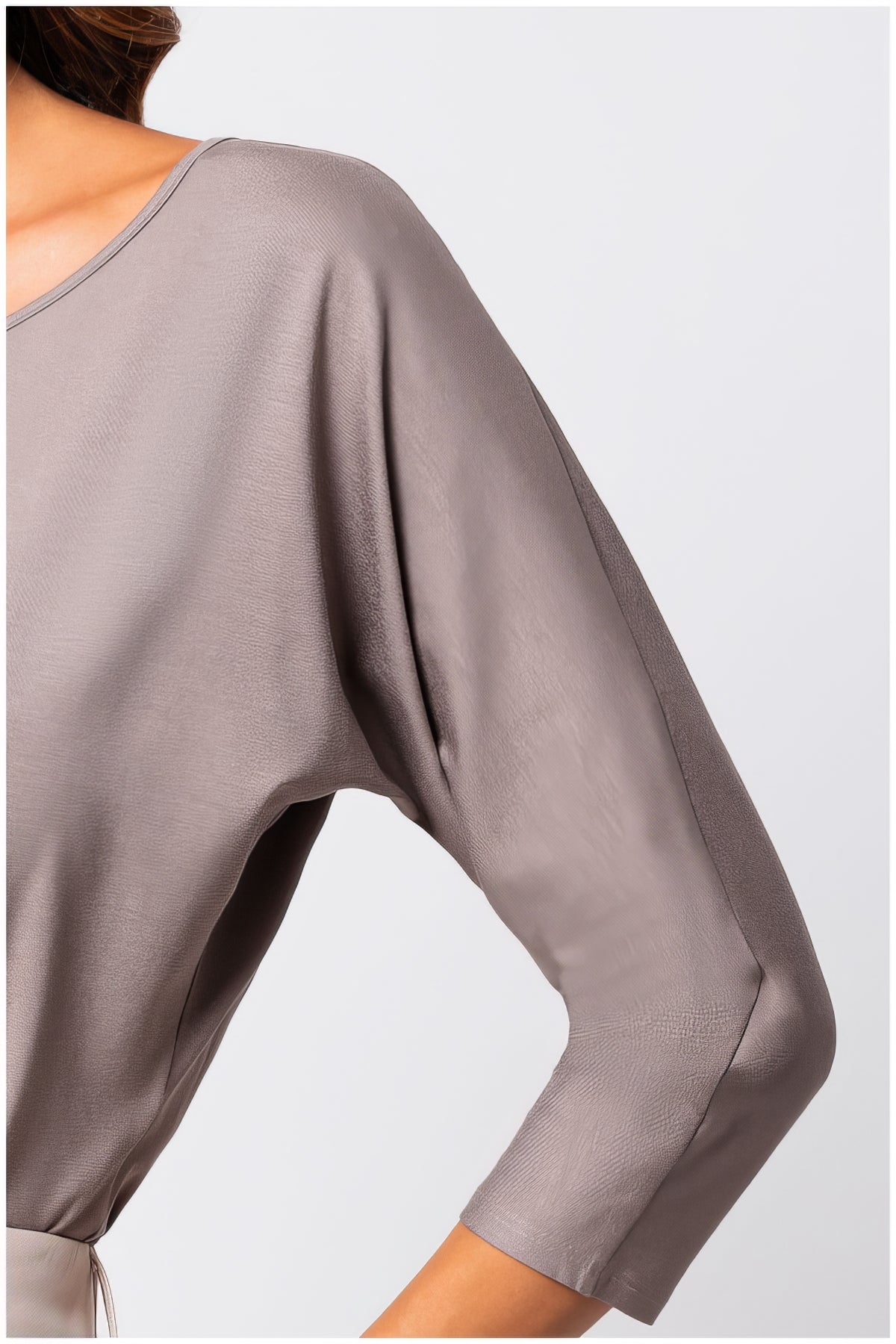 Close-up of soft fabric and relaxed sleeve detail on Eva Classic Top in Taupe Grey showcasing elegant drape and smooth texture