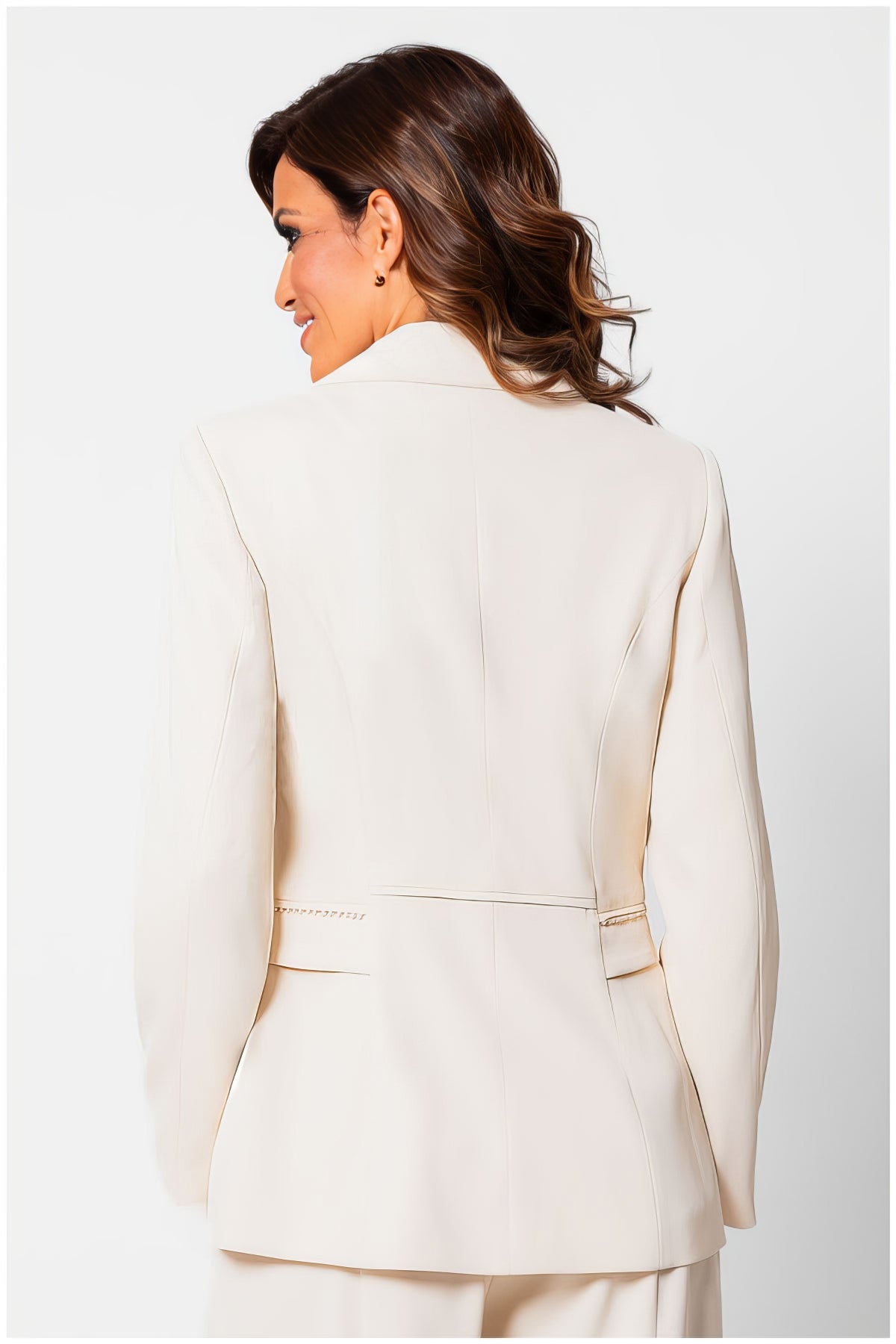 Back view of a woman wearing the Agatha Pearl Detail Blazer in Ivory showcasing tailored elegance and pearl accents