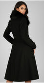 Model wearing Lucy Wool Coat with Fur Collar in Black showcasing its elegant tailored fit and luxurious design from the back