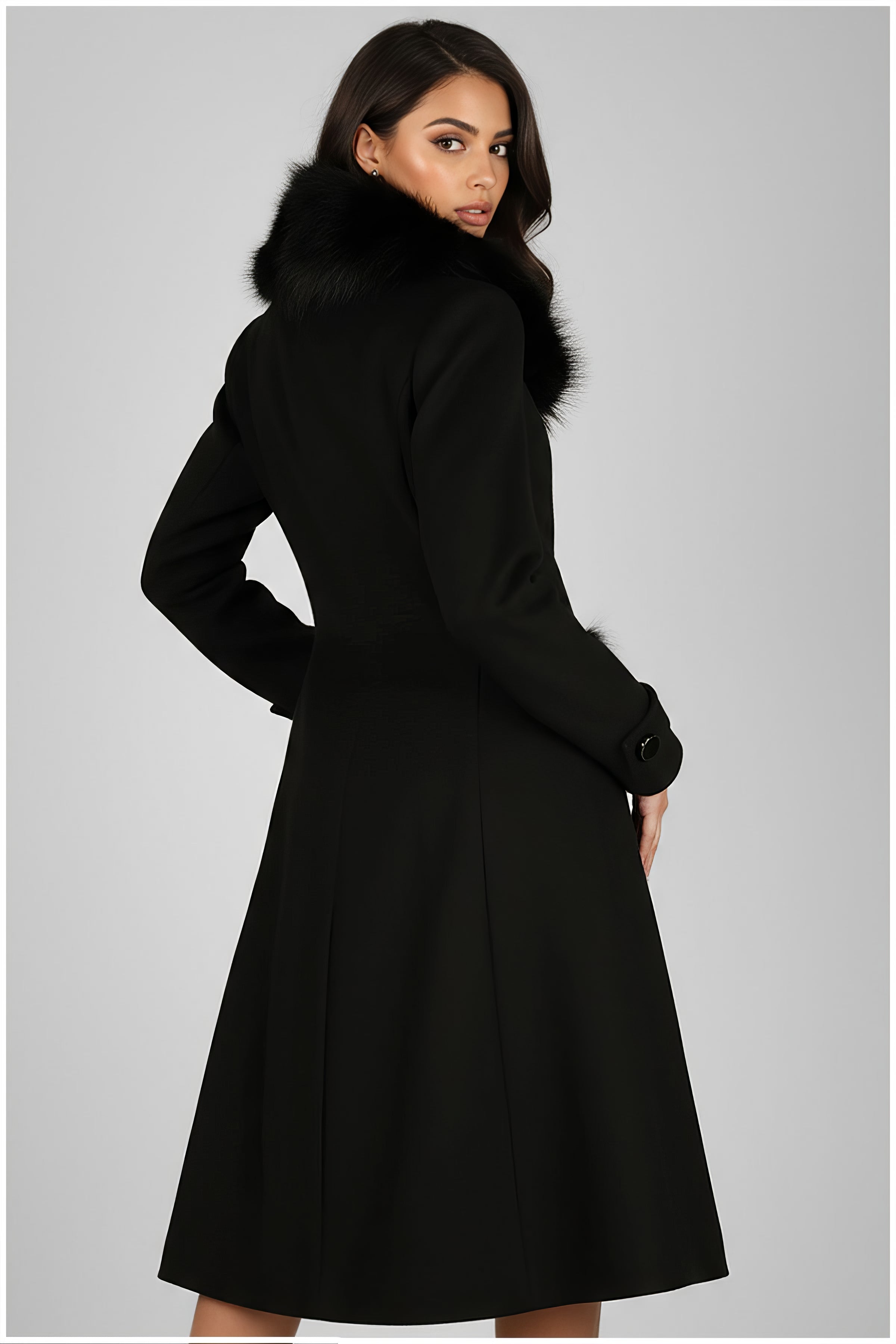 Model wearing Lucy Wool Coat with Fur Collar in Black showcasing its elegant tailored fit and luxurious design from the back
