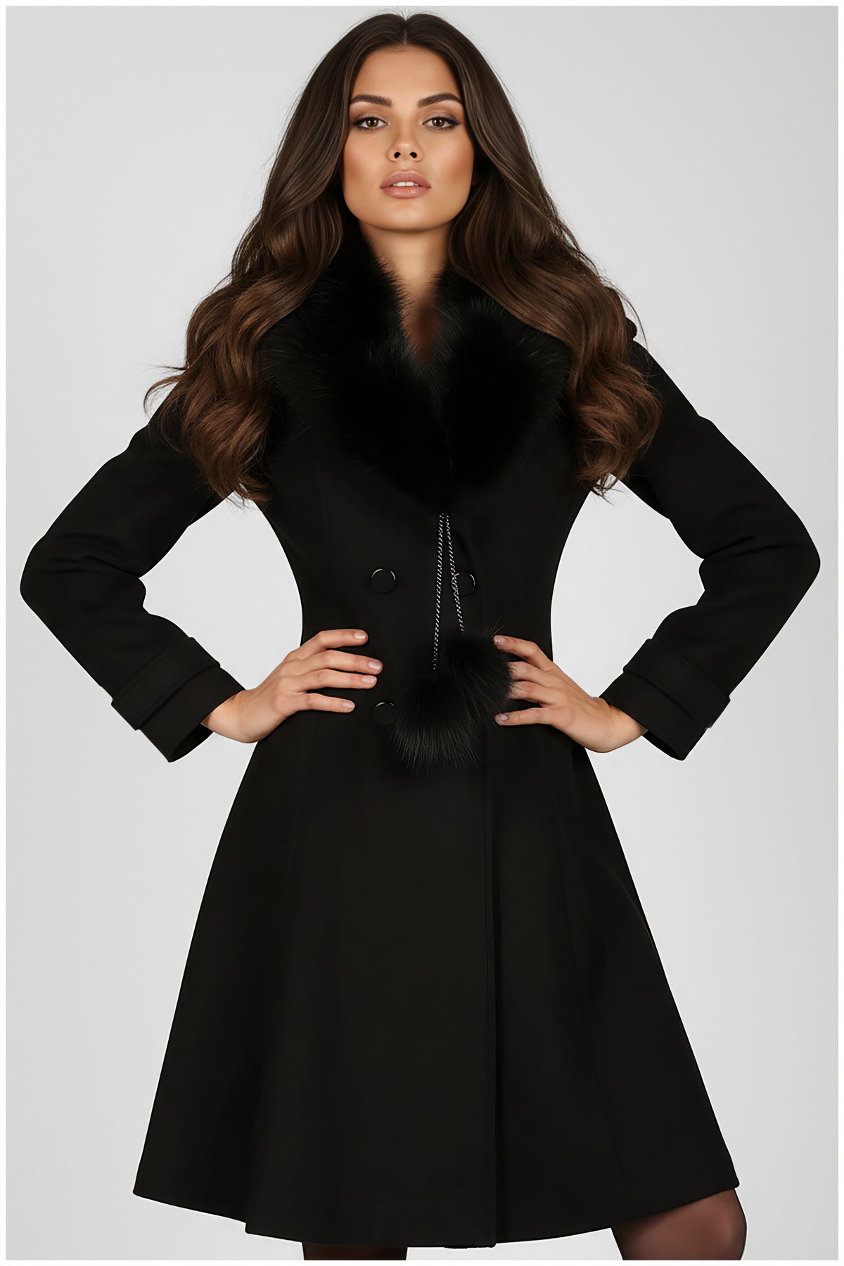 Black Wool Coat with Fur Collar, Lucy. Wool coat. Faux fur collar with pompom ties, double-breasted, flared skirt, on model.