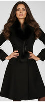 Woman wearing Lucy Wool Coat with Fur Collar in Black with elegant tailored fit and plush fur detailing