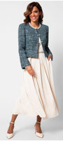 Woman wearing Rhea Tweed Blazer with Pearl Trim in Turquoise Black styled with a flowing cream dress and heels