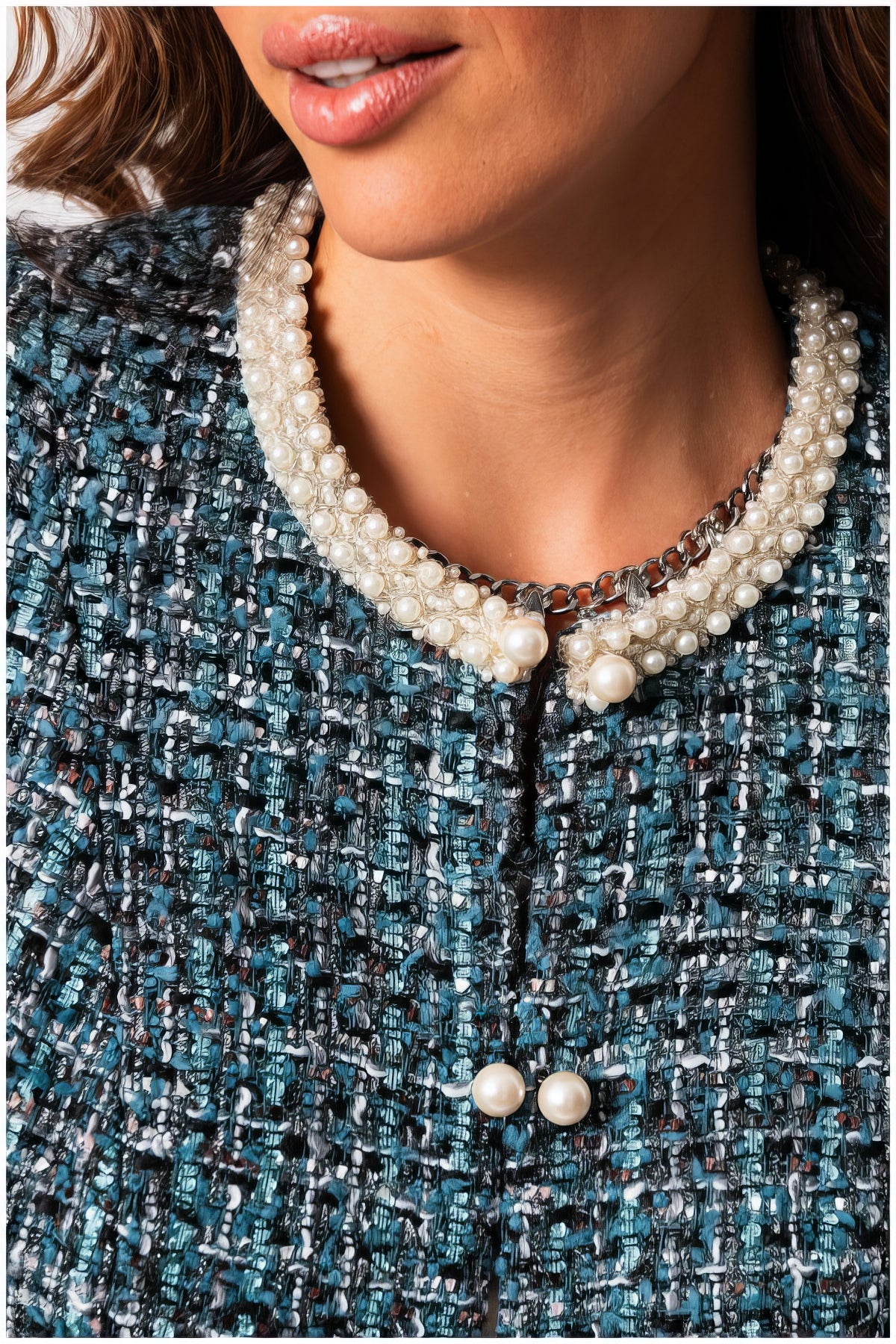 Close-up of Rhea Tweed Blazer with Pearl Trim in Turquoise Black showing textured fabric and elegant pearl accents on collar and buttons
