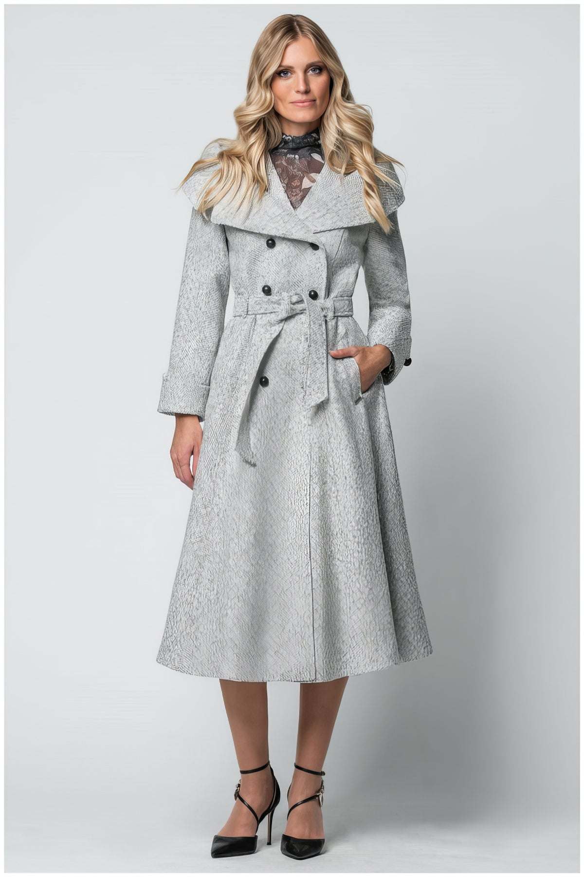 Woman wearing Nicole Wool Wrap Coat in Herringbone Gray with belted waist and double-breasted front details.