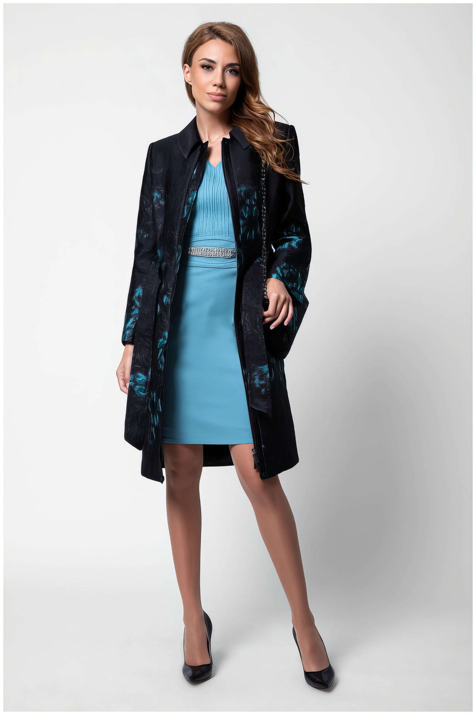Woman wearing Emma Light Coat with Teal Floral Jacquard over a teal dress and black heels against a white background