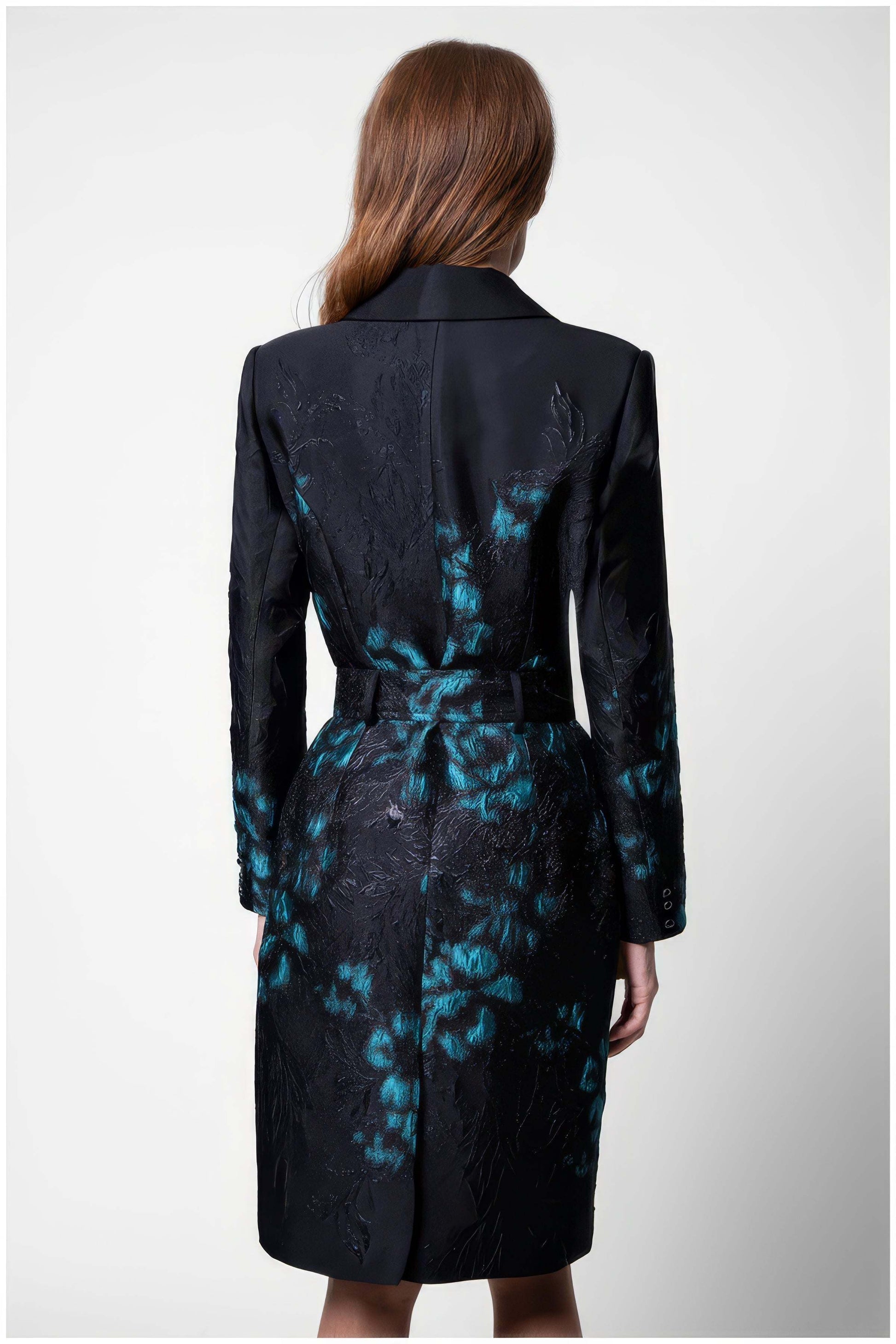 Back view of Emma Light Coat with Teal Floral Jacquard featuring black fabric with teal floral jacquard patterns and belt detail