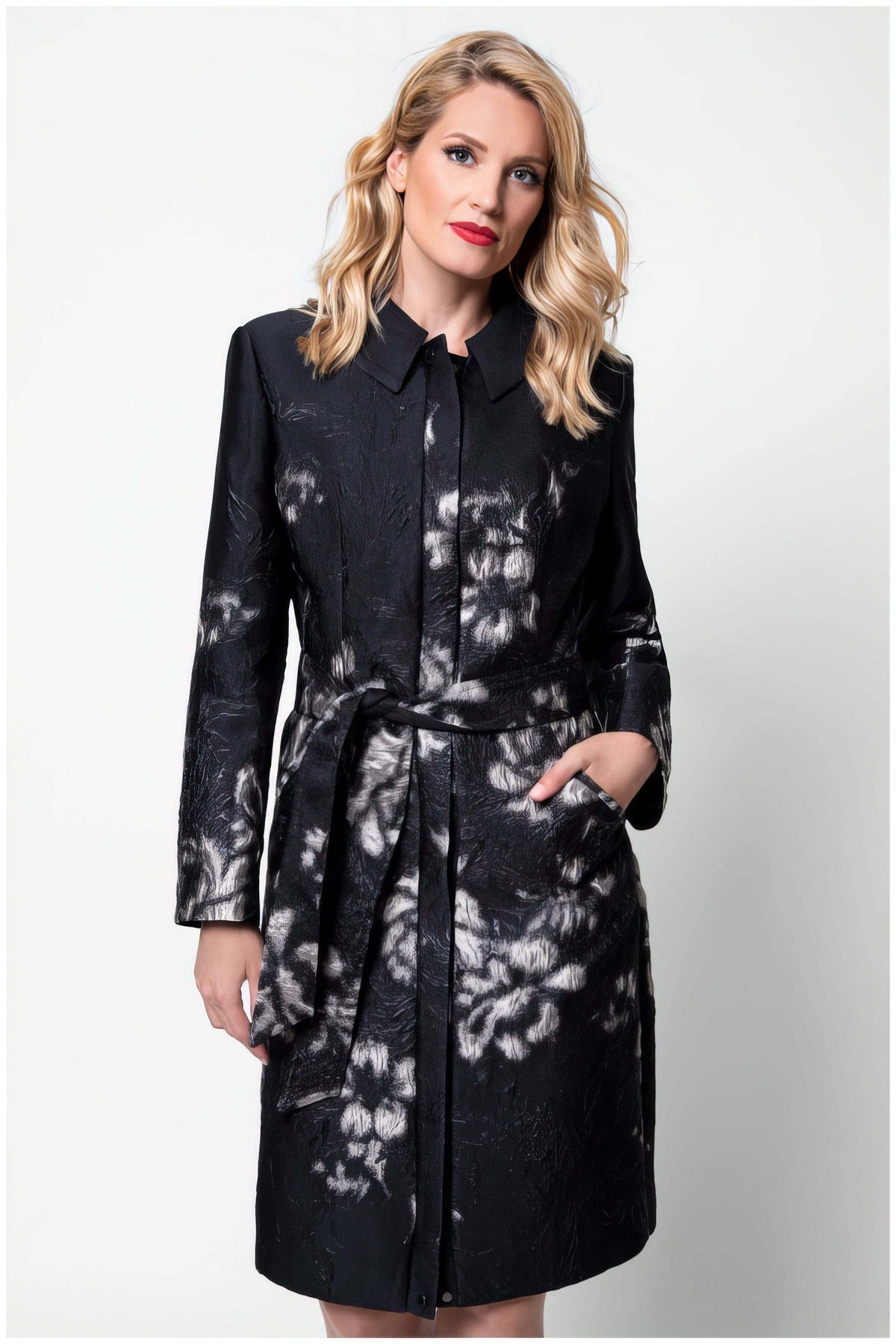 Silver Floral Jacquard Light Coat, Emma. Light coat. Black jacquard with silver floral pattern, shirt collar, and self-tie belt, on model.
