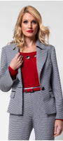 Woman wearing Elena Houndstooth Tailored Blazer with matching pants and red top, showcasing elegant tailored fit.