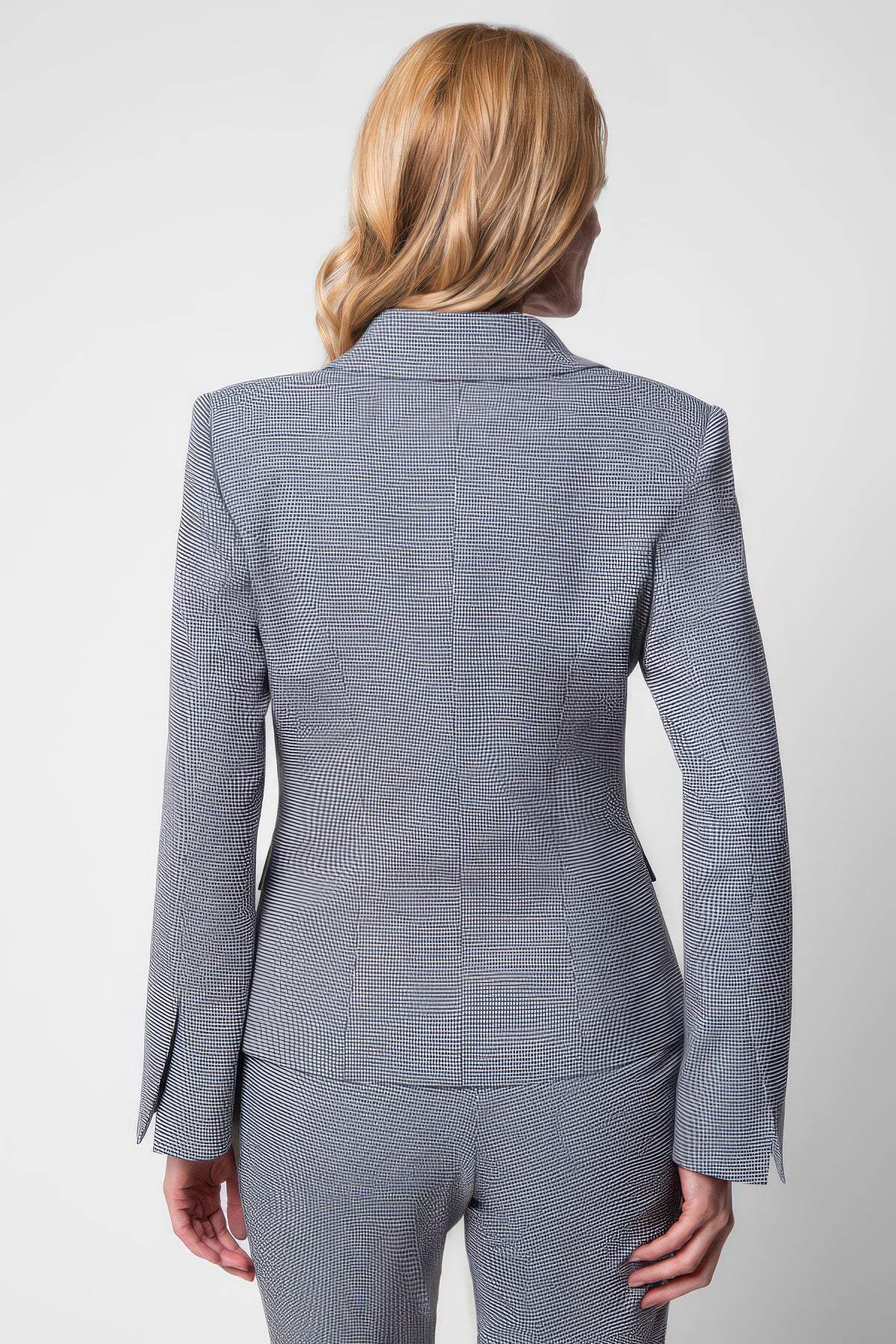 Back view of a woman wearing Elena Houndstooth Tailored Blazer with matching pants in a fitted silhouette.