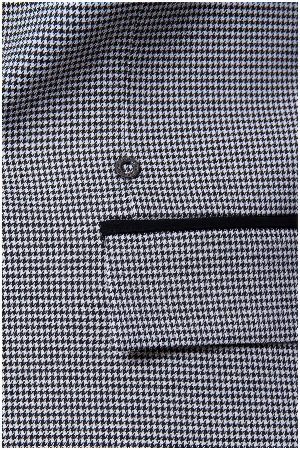 Close-up of the Elena Houndstooth Tailored Blazer showcasing its fine houndstooth pattern and button detail