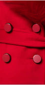 Close-up of red Selina Wool Coat with Faux Fur Collar showing double-breasted buttons and tailored fabric texture.