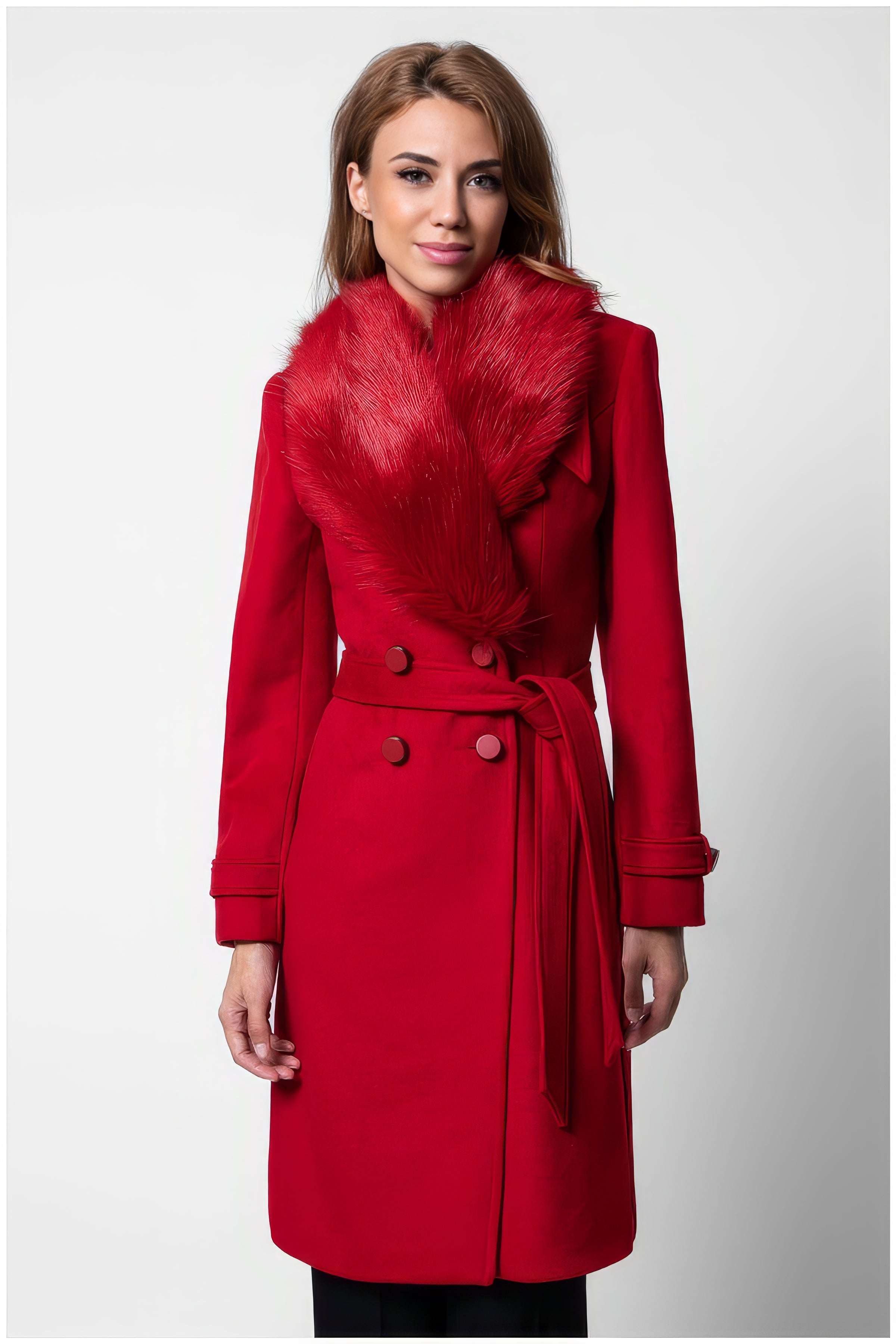 Woman wearing a red Selina Wool Coat with Faux Fur Collar featuring a belted waist and double-breasted buttons