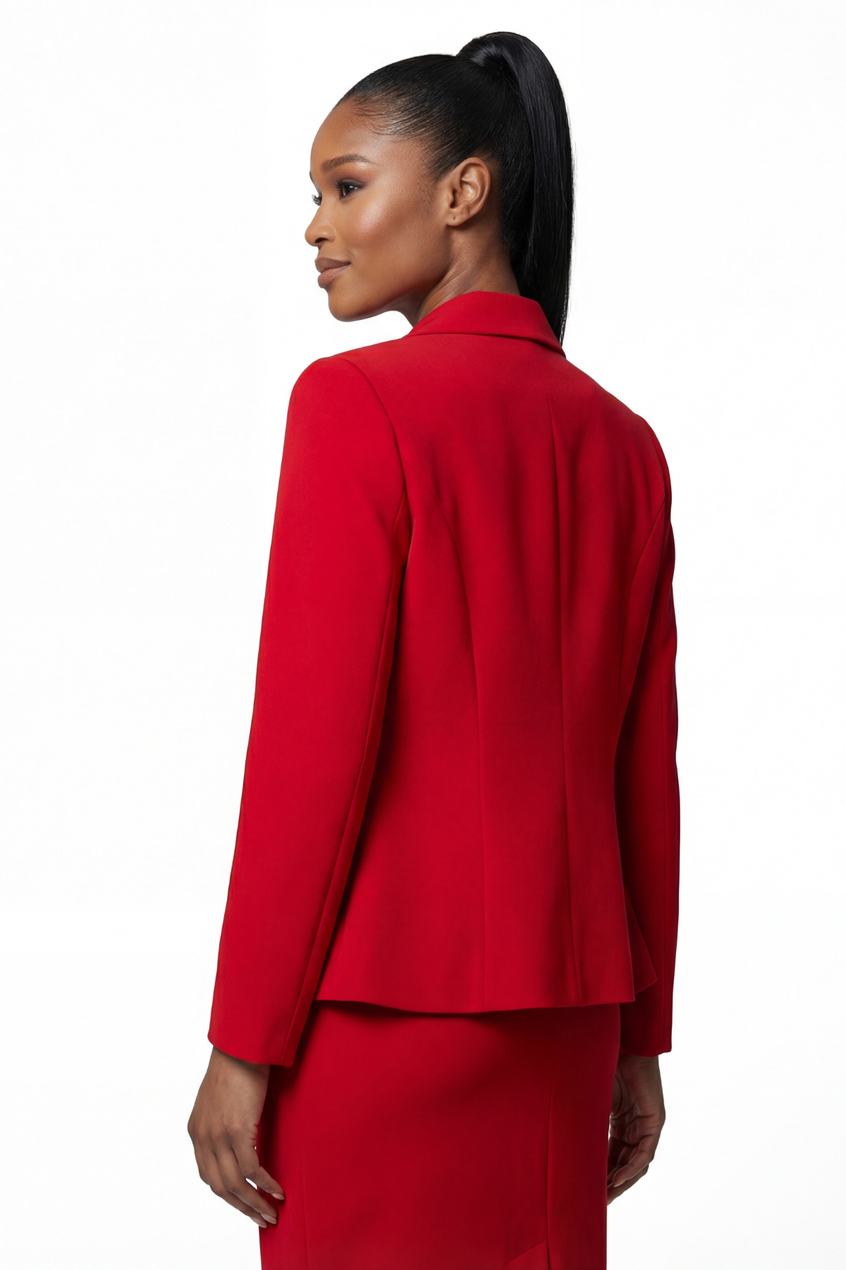 Woman wearing a red suit on a white background